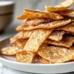 Crispy papas fritas on a plate.