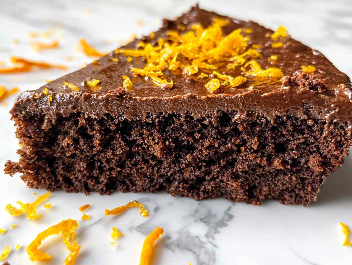 Whole prolific oven chocolate orange almond cake in a pan.